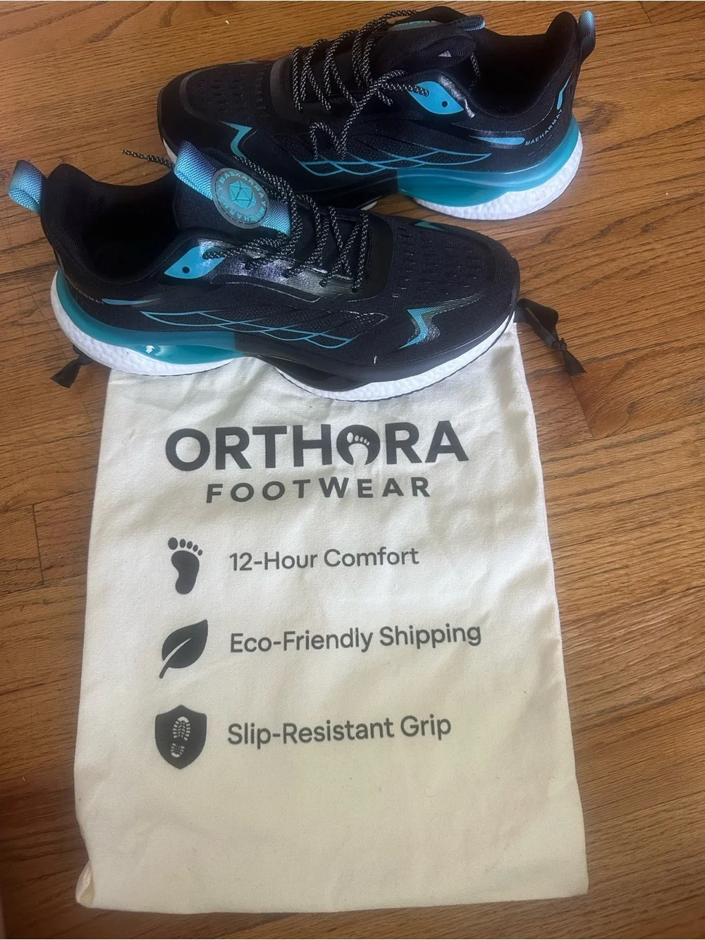 Orthora Black Sneakers with Teal Accents